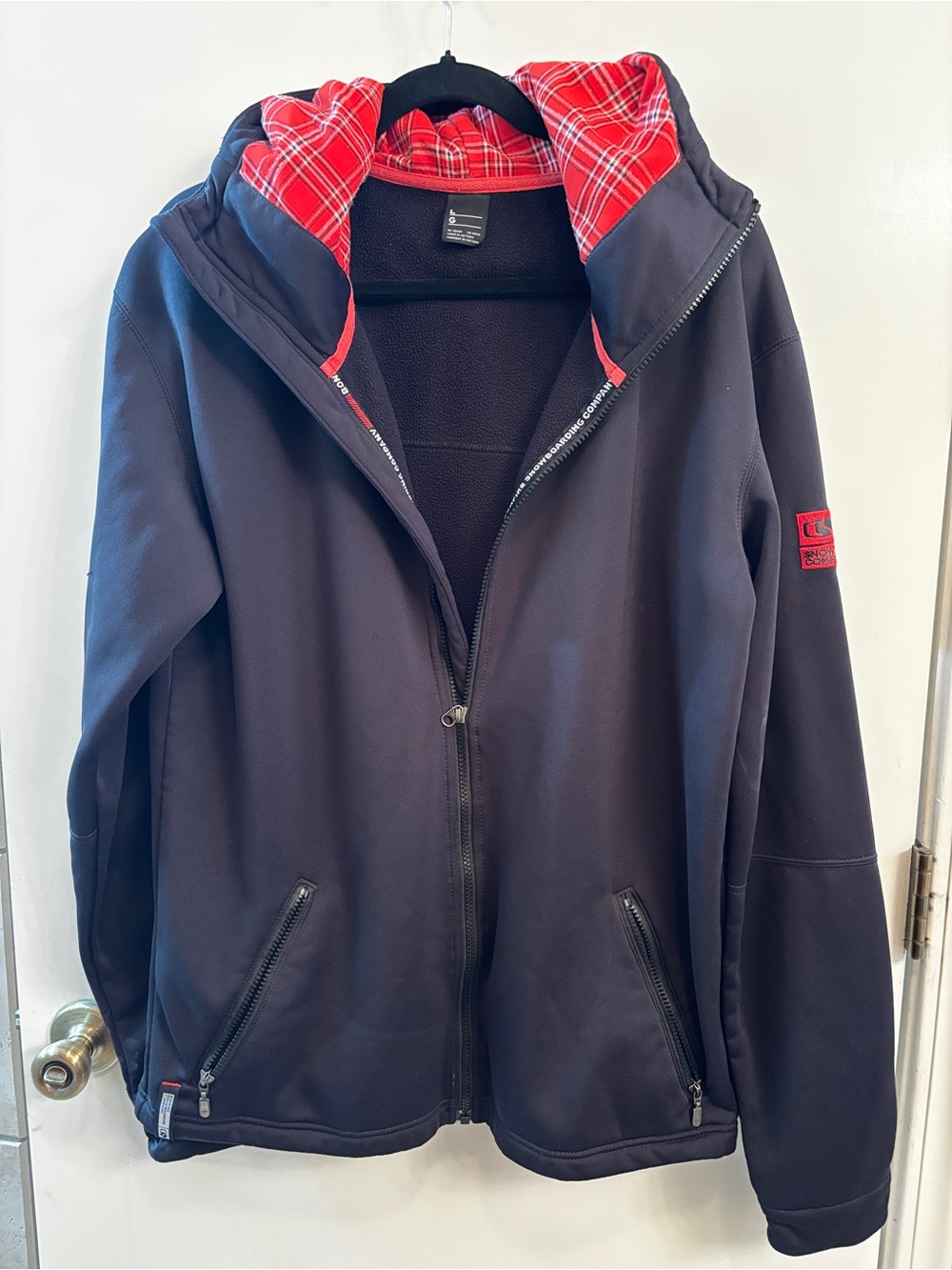 Bonfire Snowboarding Co. Men's Black Hooded Jacket with Red Plaid Lining